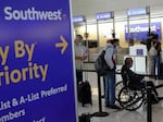 Passengers wait in line at Ronald Reagan Washington National Airport on October 11, 2021 in Virginia.