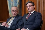 FILE—Senate Minority Leader Chuck Schumer, D-N.Y., left, and Speaker of the House Mike Johnson, R-La., sit together during a holiday event at the Capitol in Washington, Tuesday, Dec. 12, 2023. House Republicans have unveiled a 99-page spending bill that would keep federal agencies funded through Sept. 30, a process that normally demands a bipartisan effort. (AP Photo/J. Scott Applewhite, File)