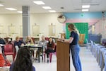 One of the incarcerated women in PSU's "Metamorphosis" class gives a presentation in March. That was the last in-person class for the students. As spring semester comes to a close, work is done via printed out packets.