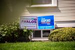 A house displays signs for Canda Avalos, a Portland City Council candidate, and Teressa Raiford, a Portland mayoral candidate, in the front yard in the Southeast Portland neighborhood of Brooklyn on Monday, April 20, 2020.