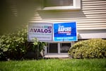 A house displays signs for Canda Avalos, a Portland City Council candidate, and Teressa Raiford, a Portland mayoral candidate, in the front yard in the Southeast Portland neighborhood of Brooklyn on Monday, April 20, 2020.