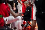 Portland Trail Blazers head coach Micah Nori speaks with players in a huddle.