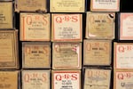 More player piano rolls. Michael Bryant revived old, dust-covered pianos, selling them during "The Sting" craze. His craft demanded rare materials like kangaroo leather. 