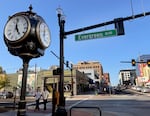 Pedestrians walk at the intersection of Main Street and Evergreen Boulevard in Vancouver, Wash., on Sept. 19, 2026, after completion of the street's redevelopment project that removes curbs and adds decorative overhead lighting, among other improvements.