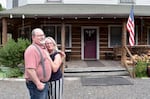 Don and Denise Rowlett stand in front of the historic Pinehurst Inn, which they have owned since 2008.
