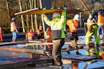 Workers with the Puyallup Tribe put the walls up on a new manufacturing facility in Fife, Wash., in March 2024. This facility will host 3D printing and other manufacturing prep work on the new flow batteries for Skip Technology.