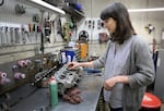 Marie Gluesenkamp Perez evaluates a part that requires maintenance at Dean's Car Care, an auto-repair shop located in NE Portland which she co-owns with her husband on June 30, 2022. Gluesenkamp-Perez, a Democrat, is a candidate for Washington's 3rd Congressional District.
