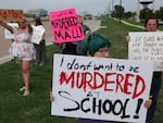 People protest against gun violence on May 7, 2023 in Allen, Tex., after a mass shooting at an outlet mall in the community.