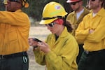Brna practices using a compass during guard school, a week-long training course for new firefighters.