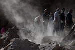 Rescue teams and civil protection members search the rubble for bodies of victims that perished in the devastating earthquake in Imi N'Tala, Morocco, on Sept. 13.