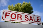 A for sale sign is displayed outside of a home for sale in Los Angeles, Calif., on Aug. 16, 2024.