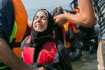 A young woman shows the strain of the trip across Turkey and into the straits between Turkey and Greece
