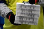 Boxes containing the Pfizer-BioNTech COVID-19 vaccine are prepared to be shipped at the Pfizer Global Supply Kalamazoo manufacturing plant in Portage, Mich., Sunday, Dec. 13, 2020. Health care workers were the first to receive vaccinations on Monday.