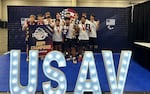 The Portland Chaos 18 and under boys volleyball team won the American division title on June 29, 2024, at the 2024 USA Volleyball Boys National Championship in Dallas, Texas. The team's members attend high schools in the Portland metro area. Co-captain Lopaki Laban is shown holding the trophy and an MVP award in the photo, along with fellow co-captain Given Unwin who is standing behind him holding a medal and an All Tournament Team award.