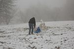 There is just enough snow at Portland's Council Crest Park for this youngster to enjoy a sled ride on Sunday, Feb. 18, 2018.