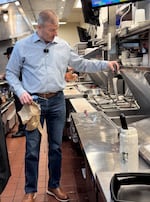 Mike Christman,  a registered environmental health specialist for Multnomah County, conducts a routine inspection of Black Bear Diner on May 13, 2026.