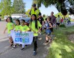 Students lead a "walking bus" with Salem-Keizer's Safe Routes to School program on May 15, 2024. The group walked from Claggett Creek Park to Kennedy Elementary School in Keizer, Ore.