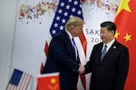 China's President Xi Jinping greets President Trump in June 2019 on the sidelines of the G20 Summit in Osaka that year.
