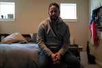 Brennan Pebbles sits for a portrait in his home on March 5, 2019 in Bend, Oregon. After a home intruder shot and killed his roommate, Pebbles used his handgun to defend himself.