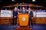 House Minority Leader Hakeem Jeffires (D-NY), joined by House Minority Whip Katherine Clark (D-MA) (L) and House Democratic Conference Chair Rep. Pete Aguilar (R), speaks at a news conference on Capitol Hill on October 22, 2025 in Washington, DC.