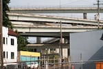 Interstate highway interchanges on the east side of the Willamette River can be seen from the site of The Low End neighborhood. 