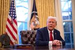 President Trump speaks to journalists in the Oval Office on Friday. A federal judge in Rhode Island has issued an order blocking the administration’s efforts to freeze some federal spending.