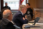 Senior deputy city attorney Ken McGair speaks at the dais.