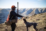 Eric Thompson gives German wirehaired pointer, Sky a drink in Sherman County, Ore., in December 2022.