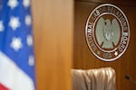 The National Labor Relations Board (NLRB) seal hangs inside a hearing room at the headquarters in Washington, D.C., U.S., in 2019.