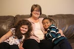Christina Walker with her son, Evan, and her daughter, Olivia, in their Portland, Tennessee, home. Walker fostered Olivia for two years before the adoption, and worked through a number of serious behavior issues with the help of Youth Village's Intercept program.