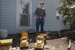 Otis Cody poses for a portrait with his model trucks in the front yard of his Fossil, Ore., home Tuesday, June 4, 2019. Cody has meticulously recreated model trucks reminiscent of those from the former company town of Kinzua.
