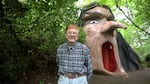 Founder and creator Roger Tofte stands in front of Enchanted Forest's 'Wicked Witch,' one of the fairytale theme park's hallmark attractions.
