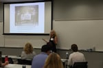 Oregon State history professor Katherine Hubler leads a session on the Holocaust and historical context.