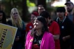 Koyama Lane listens to speakers at the event.