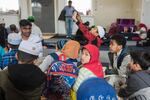 Rohingya children listen to their Quran teacher during Sunday class at Omar Farooq mosque in Portland, Ore.