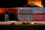 Officials work at a scene late Thursday, Sept. 3, 2020, where a man suspected of fatally shooting a supporter of a right-wing group in Portland, Ore., the week before was killed as investigators moved in to arrest him in Lacey, Wash. Michael Reinoehl, 48, was killed as a federal task force attempted to apprehend him in Lacey, a senior Justice Department official said. Reinoehl was the prime suspect in the killing of 39-year-old Aaron “Jay” Danielson, who was shot in the chest the previous weekend.