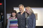 Christopher Marley poses for photos with museum-goers at his "Exquisite Creatures" exhibit.