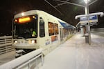 An Orange Line MAX train departs the Southeast Bybee Boulevard station toward Milwaukie in Portland's Sellwood neighborhood during a snow storm on Wednesday, Jan. 11, 2017.
