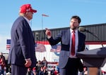 FILE - Sen. J.D. Vance, R-Ohio, right, points toward Republican presidential candidate former President Donald Trump at a campaign rally, March 16, 2024, in Vandalia, Ohio. Trump says Vance will be his vice presidential pick.