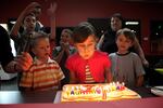 Ava celebrated her seventh birthday at a bowling alley with pizza and cake.