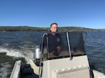 Klamath Tribes Senior Fish Biologist Alex Gonyaw boats across Upper Klamath Lake. Gonyaw is working to try to save the endangered C'waam and Koptu, or Lost River and shortnose suckers that live in the lake.