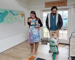 Eugene artist Liza Mana Burns spends quality time with her husband Zane Hager and her two children Henry, right, and Tommy, in her Eugene studio. Burns became a freelance artist so that she could spend more time with her children.