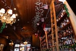 Bills stuck to the ceiling at Kells Irish Pub in Portland, Ore., on March 13, 2026. Over the course of the year, patrons of the bar throw money up onto the ceiling as part of a yearly fundraiser for Providence Center for Medically Fragile Children.