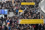 People wait in a TSA line at the John F. Kennedy International Airport, Sunday, March 22, 2026, in New York. (AP Photo/Yuki Iwamura)