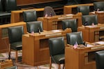 Empty chairs in a formal government chamber