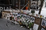 A memorial is set up among the remains of Ria Pizzeria, a beloved restaurant in Kramatorsk that was hit by a Russian strike in June 2023, killing staff and customers.