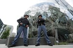 The Washington State Patrol said Tuesday that 74 commissioned officers — 67 troopers, six sergeants and one captain — were among those who left the agency due to the mandate.  Two Washington State Troopers stand guard at the Amazon Spheres on May Day, Tuesday, May 1, 2018, in Seattle. 