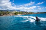 The local surfing community are shuttling donated items on jet boats from large boats to the shore in Lahaina.