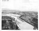 This aerial view is looking northeastwards towards Oregon City, with the river level so high that Willamette Falls was temporarily almost eliminated. Just below the center of the photo, one can see downtown Oregon City and the tower of the Oregon City Municipal Elevator.