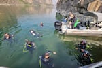 Divers get ready to search for adult quagga mussels in the mid-Snake River.